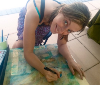 Erin Linton working on an original piece of art while in her booth at Lithia Artisans Market. 