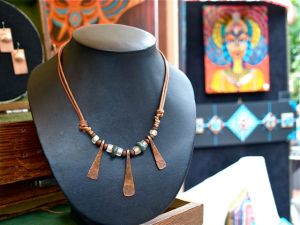 Jewelry by Marcus Scott. Forged copper pieces mixed with found jade from Northern California and old trade beads. Weekends on Calle Guanajuato, Ashland, Oregon. 