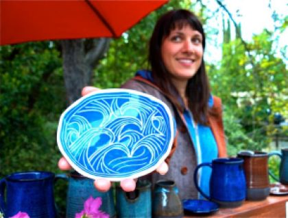 Lisa Eldredge Pottery whose image is featured on the banners that went up this week along Winburn Way. 