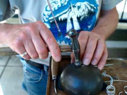 These are the working hands of Dan Clark, a seasoned silver smith and lapidary artist. Simple tools and skilled hands create beauty. 